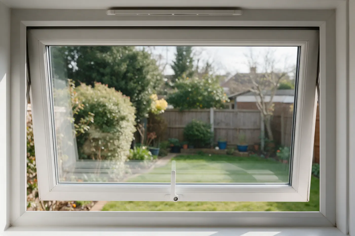 A double-glazed casement window with a trickle vent in the frame