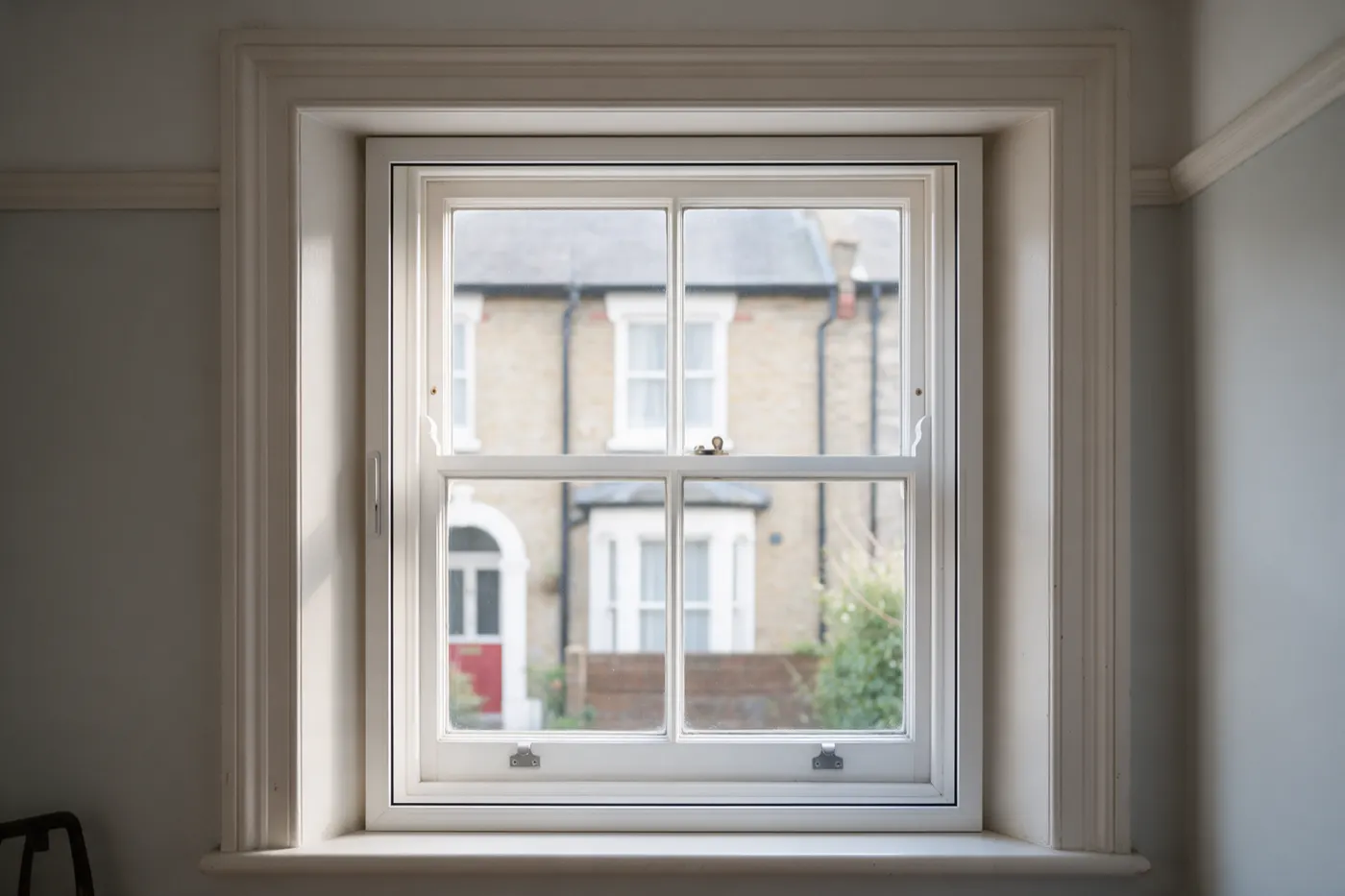 A slim secondary glazing panel fitted inside a timber sash window